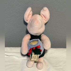 Disney Winnie the Pooh character of Piglet. Plush toy by Gund.